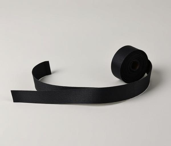Roll of narrow one inch black webbing