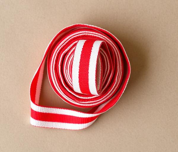 Roll of red and white striped canvas webbing